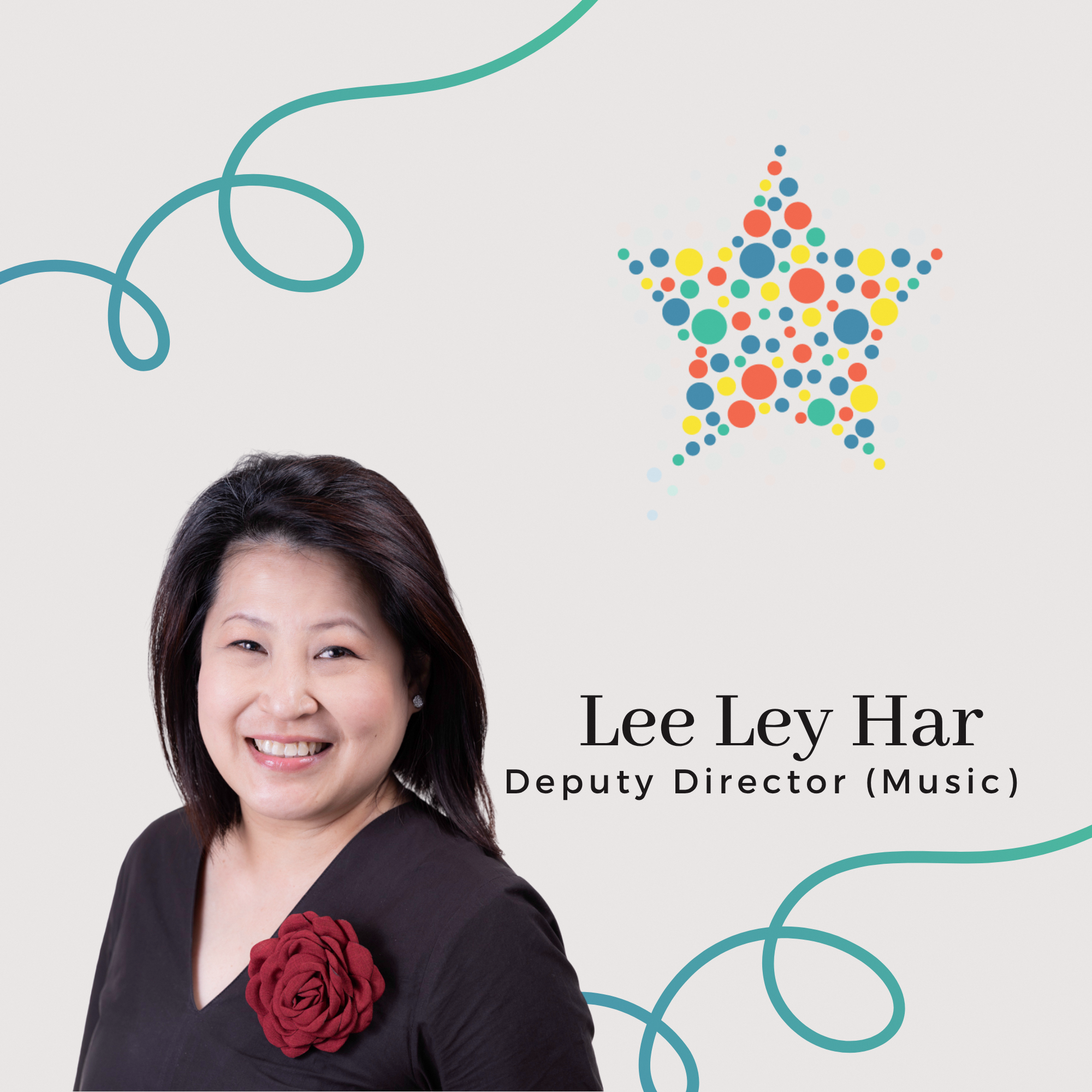 Profile photo of Lee Ley Har, Deputy Director (Music). A portrait of her smiling warmly at the camera, wearing a dark outfit with a prominent red flower accessory.